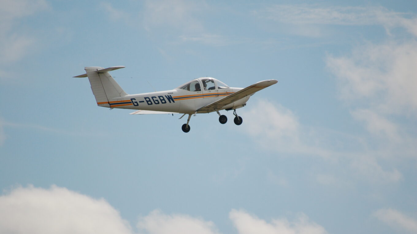 Piper Tomahawk flying over Tollerton Airport