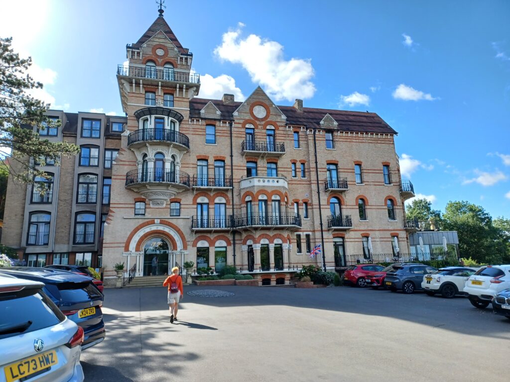 A view of the Petersham Hotel, Richmond on Thames. The building is a 4 storey brick building, with a tower on the left hand side.