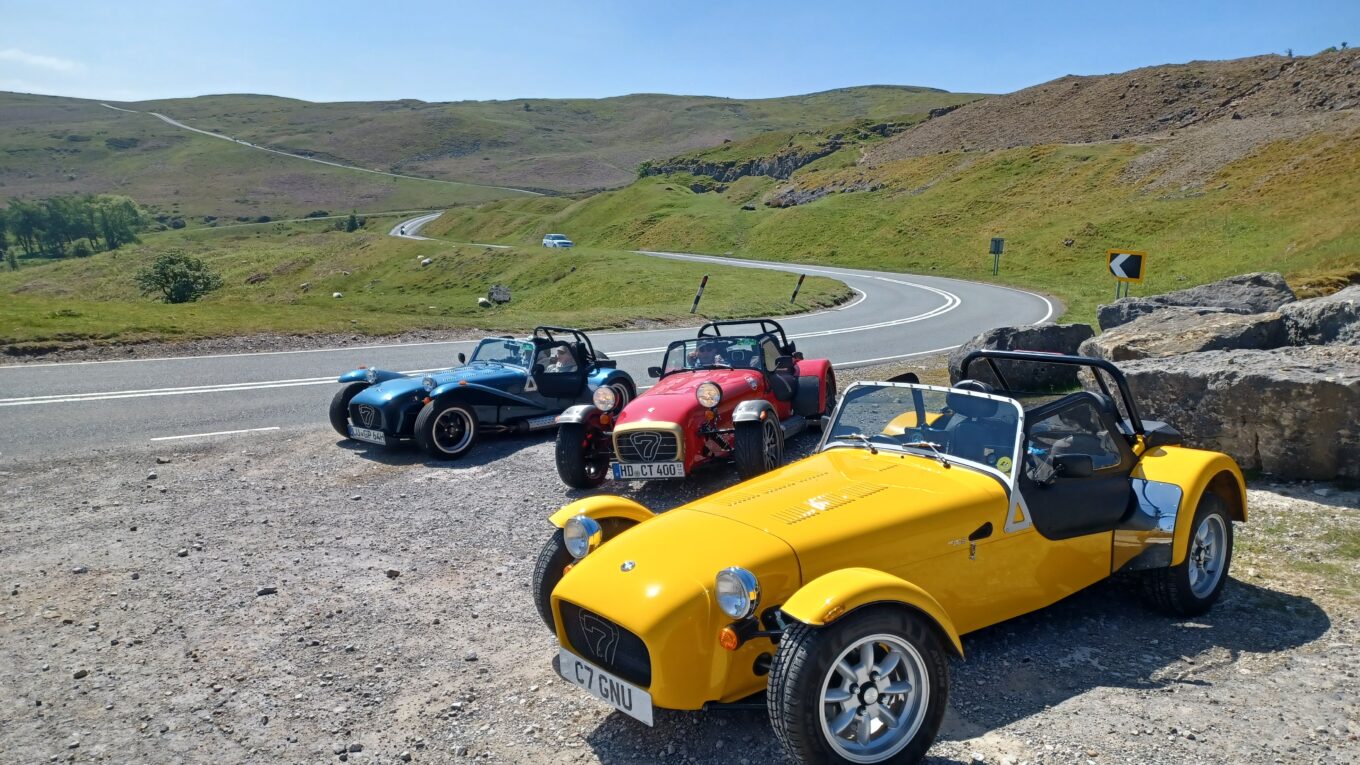 Gnu (the yellow Caterham 7 in the foreground) on the Black Mountains Road, Brecon Beacons, Wales. There are two other Caterham 7's in the background.